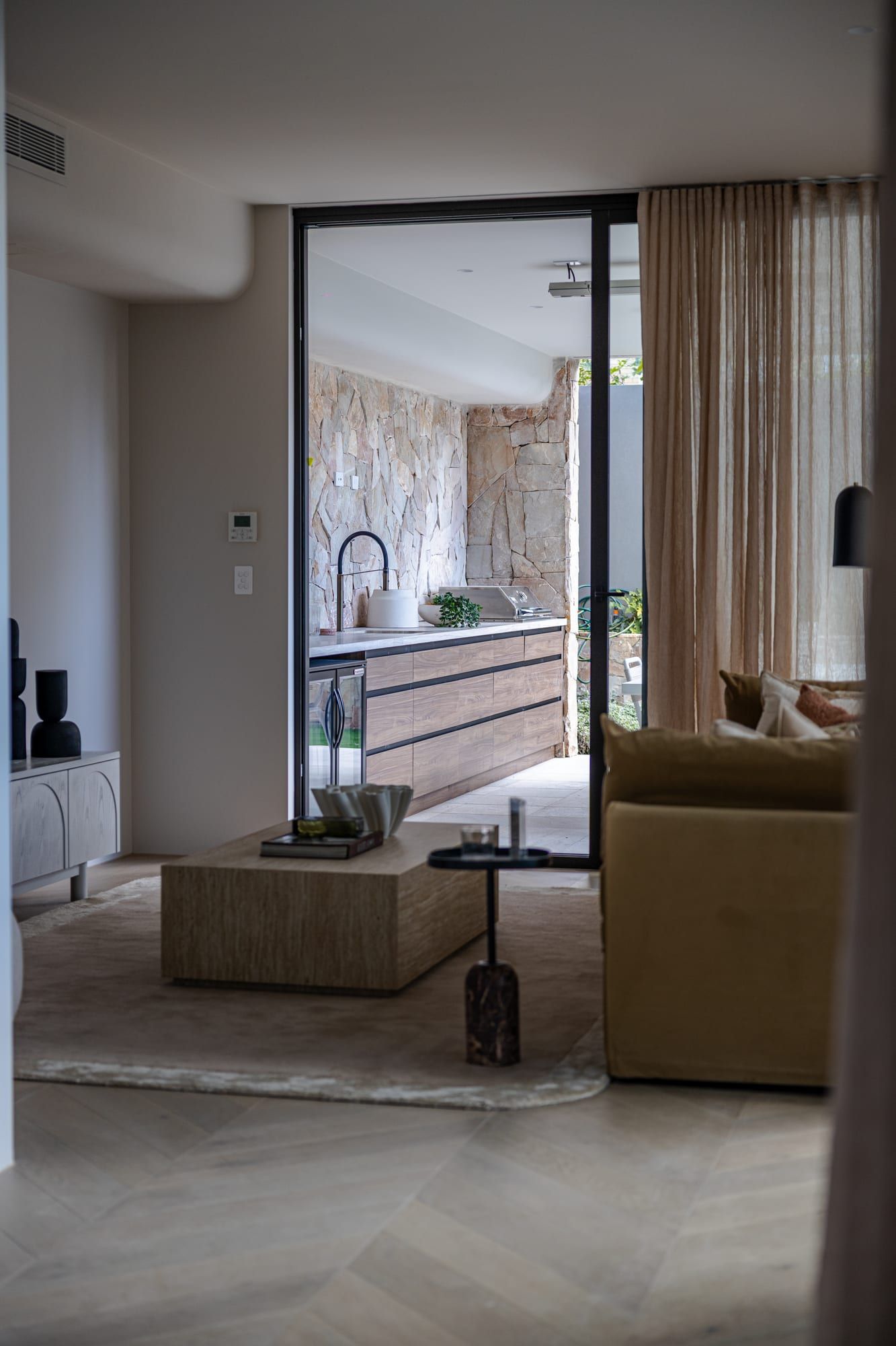 Living room opening to the garden in a completed Pelican Projects home in Sylvania